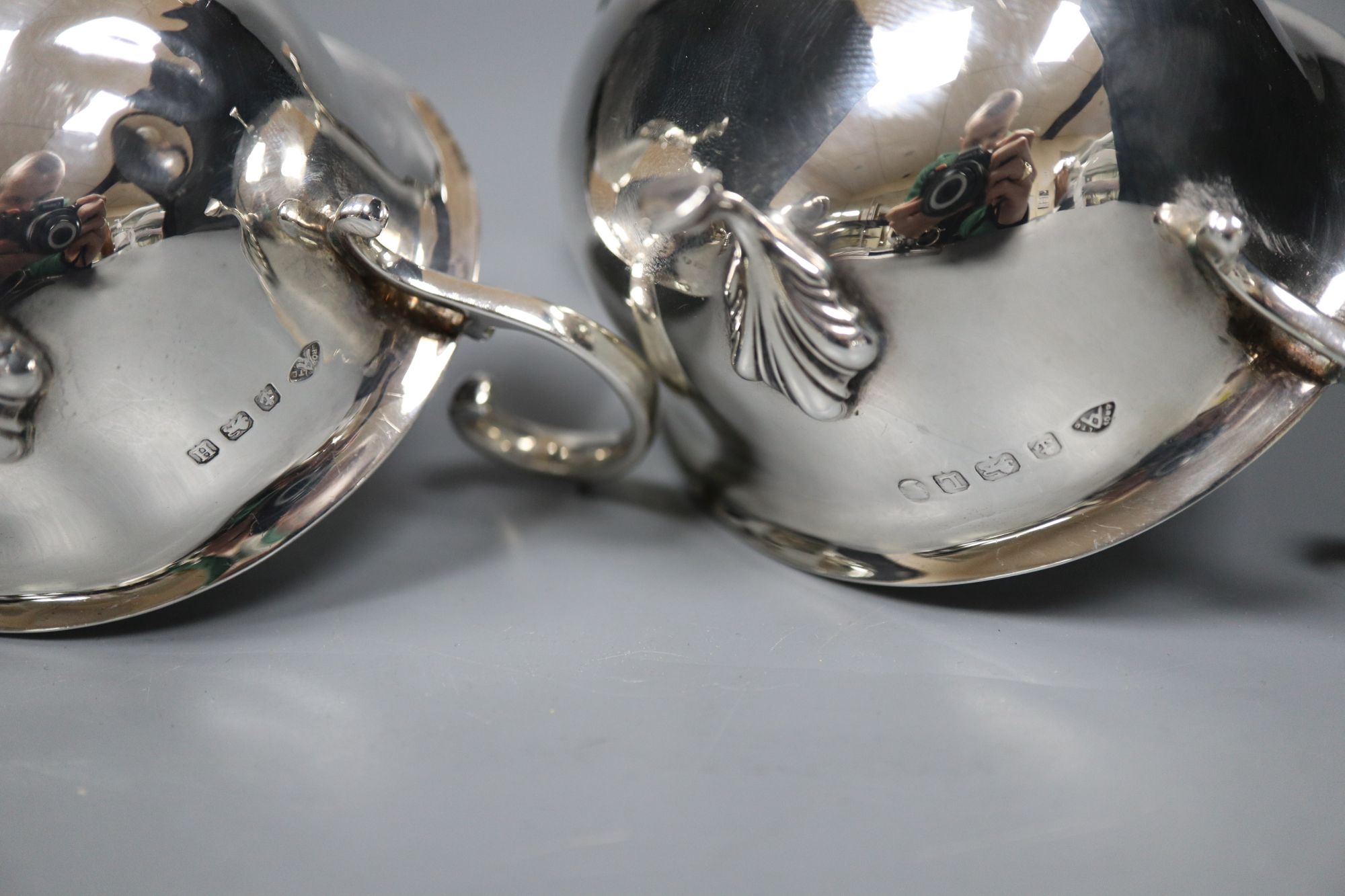 A pair of 1930s silver sauceboats, 5.5 oz and a plated sauceboat.